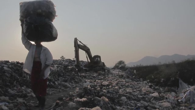 Illegal migrant worker in rubbish dump site in Mae Sot, Thailand.