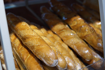 Fresh baguettes on the shelf in the supermarket.