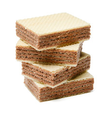 Several waffle tiles lie down a heap. Isolated white background.