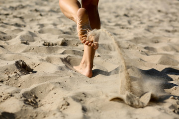 Fit woman doing cardio train at the beach. Closeup shot