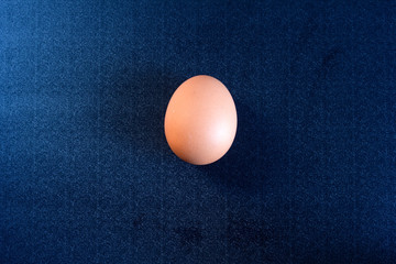 chicken eggs in a cardboard tray on background