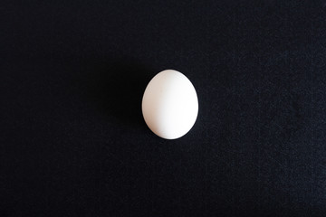 chicken eggs in a cardboard tray on background