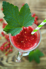 Cocktail or milk drink yogurt from red currant is poured into a glass bowl