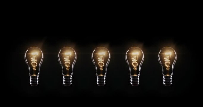 Flickering Tungsten light bulbs lamp over black background