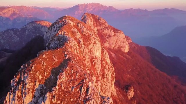 fly away footage of hikers on top of a high mountain in northern Italy, Corni Di Canzo