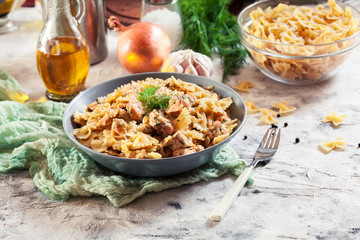Creamy farfalle pasta with salmon, parmesan cheese and dill