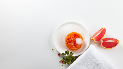 Handmade soap on a white background. Skin care product with the scent of grapefruit and wild berries. Spa treatments and aromatherapy for smooth and healthy skin.