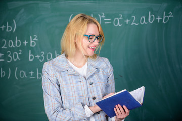 What make great teacher. School teacher explain things well and make subject interesting. Effective teaching involve acquiring relevant knowledge about students. Teacher woman explain near chalkboard