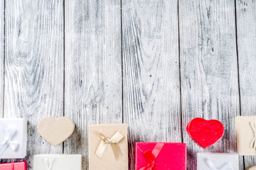 Valentine day concept, old grey wooden background with gift boxes, top view copy space