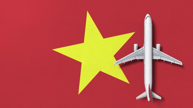 Airplane on the flag of Vietnam. Flights related conceptual 3D animation 