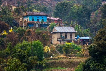 Fototapeta na wymiar primitive small houses in nepalese village beautiful landscape in Nepal Himalayas mountains, terraced fields
