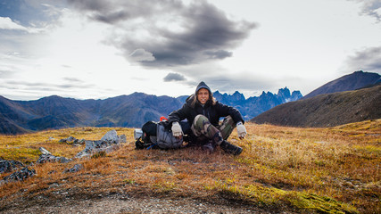 Young hiker resting in Tombstone Park in Yukon Canada
