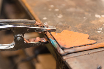Work with welding in the carpentry shop. Weld metal parts. Dangerous industry