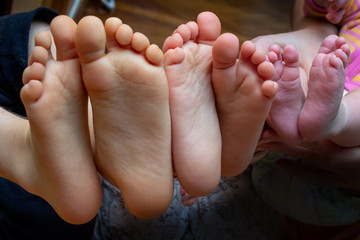 bare feet of several children