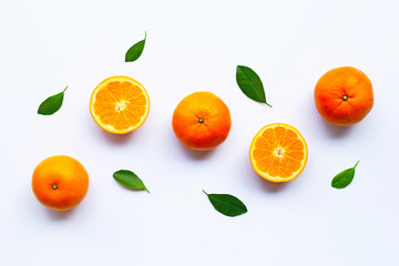 Fresh orange citrus fruits with leaves on white background.