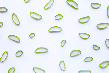 Aloe vera slices on white background.