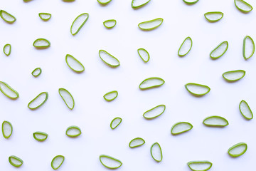 Aloe vera slices on white background.