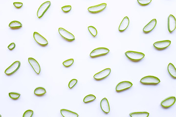 Aloe vera slices on white background.
