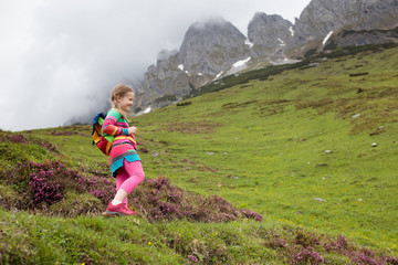 Naklejka na ściany i meble Children hiking in Alps mountains. Kids outdoor.