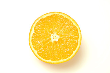 Close up image of juicy organic halved orange with visible core texture on isolated white background with a lot of copy space for text. Macro shot of bright citrus fruit. Top view.