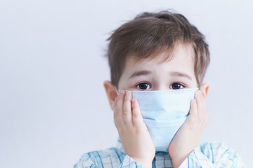 young three year old boy in medical mask, concept of quarantine and protection from polluted air