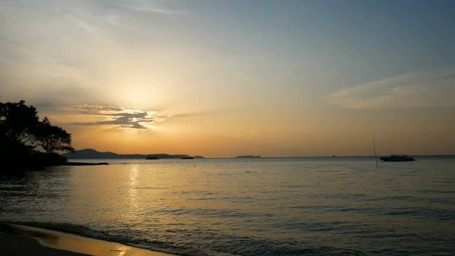 4K footage of beautiful sunset above the sea at tropical beach