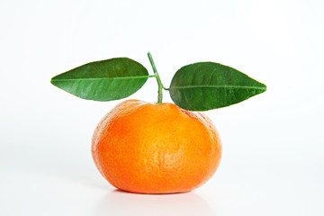 Close up image of one juicy organic whole tangerine with green leaves & visible zest texture, isolated white background, copy space. Macro shot of single bright citrus fruit. Top view, flat lay.