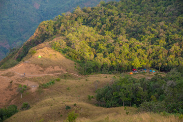 Landscape mountain valley nature forest with camping tents of northern Thailand.