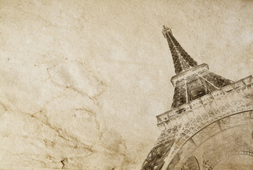 Fototapeta na wymiar Old vintage paper texture background with the silhouette of the eiffel tower in Paris. High-quality photo texture of old vintage paper with scuffs, cracks and drops of spilled coffee.