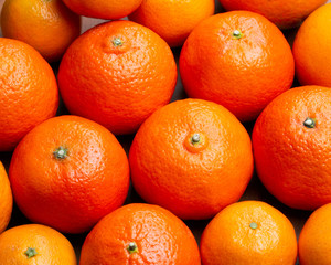 Tangerines are on the table, background with fruit