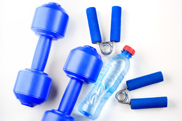 A bottle of water and sports equipment on a white background