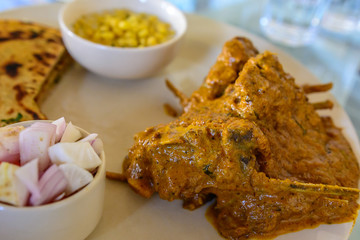 Mutton in spicy gravy served with parantha (Indian Bread) & Boondi Raita