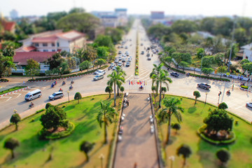 Fototapeta na wymiar Vientiane - Laos, February 25, 2016: a view of the city from above from the central gates in tiltshift style