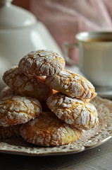 Crinkles cookies on a rustic saucer on a wooden background