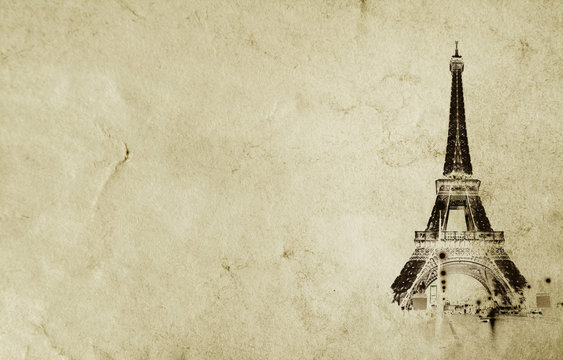 Old vintage paper texture background with the silhouette of the eiffel tower in Paris. High-quality photo texture of old vintage paper with scuffs, cracks and drops of spilled coffee.