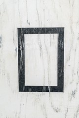 Background texture of a White painted wood board with a black frame in center.