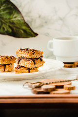 Organic Chocolate Cake Slices on a white stone background. Plant based diet dessert.Copy space for text. Selective focus.