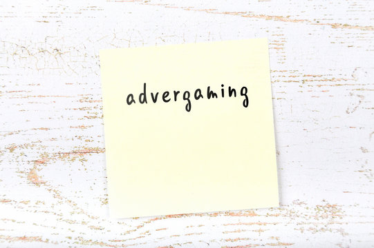 Yellow sticky note with handwritten text advergaming