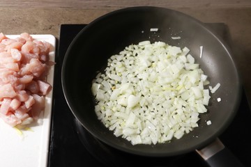 Preparation of food on a pan. Frying onion