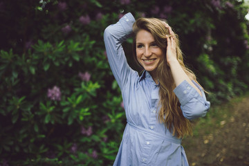 Beautilful young girl walking through a park