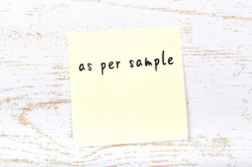 Yellow sticky note with handwritten text as per sample