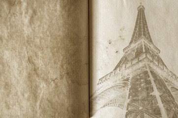 Old vintage paper texture background with the silhouette of the eiffel tower in Paris. High-quality...