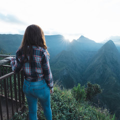 Girl watching the sunrise at Cap Noir, Reunion Island