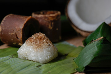 Pulut Inti. Savory glutinous rice with sweetened grated coconut wrapped in banana leaf. 