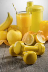 Yellow dumbbells and food