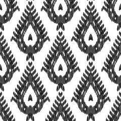 Ethnic seamless pattern. Chic boho ikat ornament. Tribal ottoman style. Can be used for textile, wallpaper, wrapping paper, greeting card background, phone case print. Black white vector illustration.