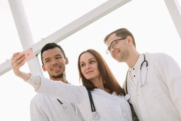 close up.group of medical doctors taking selfies.