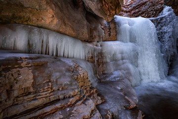 Frozen waterfall in a mountain gorge