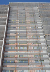 Building construction site with scaffolding