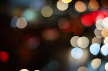 Bokeh night light on the avenue Light night at city blue bokeh sky festival abstract background blur lens flare reflection beautiful circle street with dark